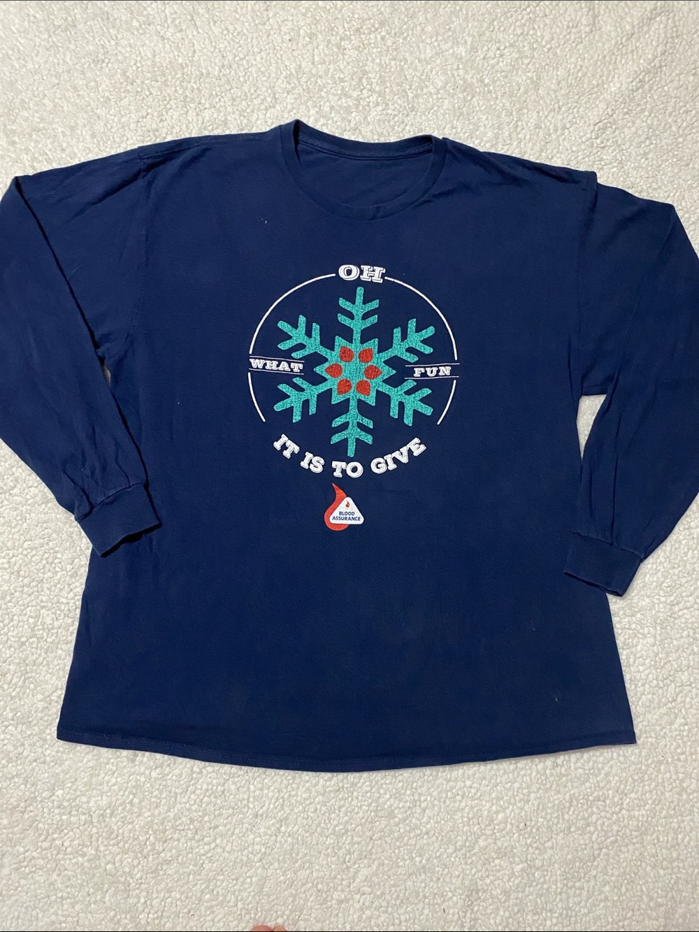 Women’s size XL long sleeve tee “ oh what fun it is to give” blood assurance